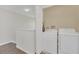 Upper-level laundry room with washer and dryer at 2720 Bushman Dr, Kissimmee, FL 34746