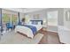 Main bedroom with a king-size bed and blue bedding at 2720 Bushman Dr, Kissimmee, FL 34746