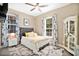 Guest bedroom with gray headboard, yellow pillows and white bedding at 305 Silver Maple Rd, Groveland, FL 34736