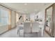 Elegant dining room with a white table and chairs near the kitchen at 316 Pelham Park Dr, Deland, FL 32720