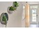 Entryway with three decorative wall planters and view to back at 316 Pelham Park Dr, Deland, FL 32720