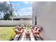 Cozy patio furniture set on a paved patio in a fenced backyard at 325 Pelham Park Dr, Deland, FL 32720