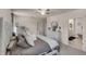 Spacious bedroom with large bed, dresser, and ensuite bathroom access at 325 Pelham Park Dr, Deland, FL 32720