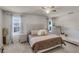 Bright bedroom featuring a cozy bed and plenty of natural light at 325 Pelham Park Dr, Deland, FL 32720