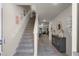 Bright and airy entryway with staircase and storage at 325 Pelham Park Dr, Deland, FL 32720