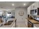 Bright kitchen featuring granite countertops and white cabinetry at 325 Pelham Park Dr, Deland, FL 32720