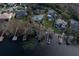 Aerial view of waterfront home with private dock and boat slips at 3818 Kinsley Place, Winter Park, FL 32792