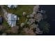 Aerial view showing house, landscaping and lake access at 3818 Kinsley Place, Winter Park, FL 32792