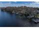 Aerial view of waterfront property with multiple docks and boats at 3818 Kinsley Place, Winter Park, FL 32792