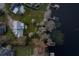 Aerial view showing house, landscaping and lake access at 3818 Kinsley Place, Winter Park, FL 32792