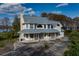 Two-story house with a wrap-around porch and large windows at 3818 Kinsley Place, Winter Park, FL 32792