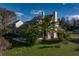 Back of house showing patio and lush landscaping at 3818 Kinsley Place, Winter Park, FL 32792