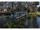 Weathered dock with gazebo situated on the lakefront at 3818 Kinsley Place, Winter Park, FL 32792