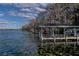 Several weathered lakefront docks with covered structures at 3818 Kinsley Place, Winter Park, FL 32792