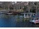 Several docks with varying conditions along the shoreline at 3818 Kinsley Place, Winter Park, FL 32792