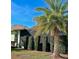 Backyard view with privacy hedge and palm tree at 5114 Jareds Landing Way, Oxford, FL 34484