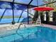 Relaxing screened pool with waterfall and tropical mural at 5114 Jareds Landing Way, Oxford, FL 34484