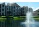 Apartment complex with a water fountain at 5545 Devonbriar Way # 205, Orlando, FL 32822