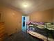 Bedroom with bunk beds and carpet flooring at 5690 Sw 202Nd Ct, Dunnellon, FL 34431