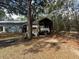 Covered boat storage area in backyard at 5690 Sw 202Nd Ct, Dunnellon, FL 34431