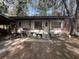 View of the mobile home with steps and outdoor seating at 5690 Sw 202Nd Ct, Dunnellon, FL 34431