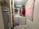 Laundry room with washer, dryer, and storage shelves at 5690 Sw 202Nd Ct, Dunnellon, FL 34431