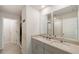 Bright bathroom featuring a double sink vanity with modern fixtures and granite countertops at 581 Sun Warbler Way, St Cloud, FL 34771