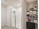 Bathroom featuring a sleek glass shower and linen storage at 581 Sun Warbler Way, St Cloud, FL 34771