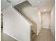 Entryway featuring tile flooring leading to a carpeted staircase at 581 Sun Warbler Way, St Cloud, FL 34771