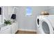 Laundry room with washer, dryer, and storage at 6029 Wildline Dr, St Cloud, FL 34771