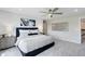 Main bedroom with a king-size bed and a stylish headboard at 6029 Wildline Dr, St Cloud, FL 34771