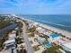 Aerial view of beach homes and coastal road at 6110 S Atlantic Ave, New Smyrna Beach, FL 32169