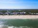 Wide shot of beach homes along the coastline at 6110 S Atlantic Ave, New Smyrna Beach, FL 32169