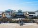 Beachfront property aerial view, showing the house and beach access at 6111 Turtlemound Rd, New Smyrna Beach, FL 32169