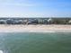 Beachfront homes and coastal landscape, aerial view at 6111 Turtlemound Rd, New Smyrna Beach, FL 32169