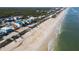 Beachfront property aerial view, showcasing homes and shoreline at 6111 Turtlemound Rd, New Smyrna Beach, FL 32169