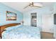 Main bedroom with king-size bed and access to a private balcony at 6111 Turtlemound Rd, New Smyrna Beach, FL 32169