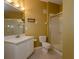 Clean bathroom with shower, toilet, and vanity with white cabinets at 6240 Contessa Dr # 101, Orlando, FL 32829