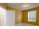 Bright bedroom with large window, walk-in closet, and tiled floors at 6240 Contessa Dr # 101, Orlando, FL 32829