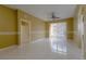 Spacious bedroom with tile floors and sliding glass doors to patio at 6240 Contessa Dr # 101, Orlando, FL 32829