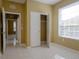 Bedroom with closet and view of hallway at 6240 Contessa Dr # 101, Orlando, FL 32829