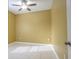 Bright bedroom with ceiling fan and tile floors at 6240 Contessa Dr # 101, Orlando, FL 32829