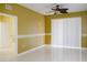 Spacious bedroom with tile floors and sliding glass doors to patio at 6240 Contessa Dr # 101, Orlando, FL 32829