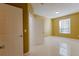 Spacious bedroom with large window, closet, and tiled floors at 6240 Contessa Dr # 101, Orlando, FL 32829