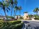 Community center with palm trees and landscaping at 6240 Contessa Dr # 101, Orlando, FL 32829