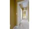 Clean hallway with tile floors and doors to other rooms at 6240 Contessa Dr # 101, Orlando, FL 32829