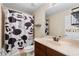 Bathroom with Mickey Mouse shower curtain and vanity at 6370 Golden Dewdrop Trl, Windermere, FL 34786