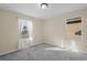 Bedroom with gray carpet and window with blinds at 6370 Golden Dewdrop Trl, Windermere, FL 34786