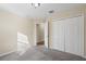 Bedroom with double door closet and carpet at 6370 Golden Dewdrop Trl, Windermere, FL 34786