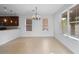 Dining area with tile floors, chandelier, and kitchen view at 6370 Golden Dewdrop Trl, Windermere, FL 34786